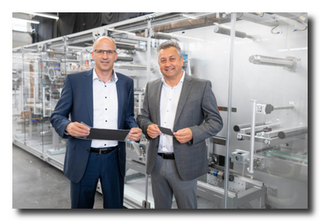 Werner Volk, Director New Applications/Concepts at Optima Life Science (left) and Juergen Bareiss, Head of Optima Life Science, with membrane electrode assemblies (MEAs). (Source: Optima)