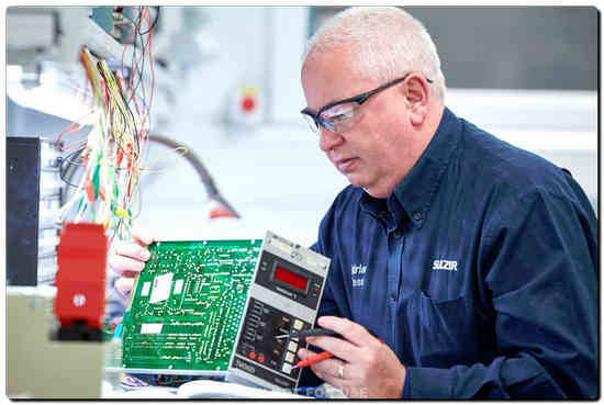 A Sulzer engineer completing the repair of an electronic control board