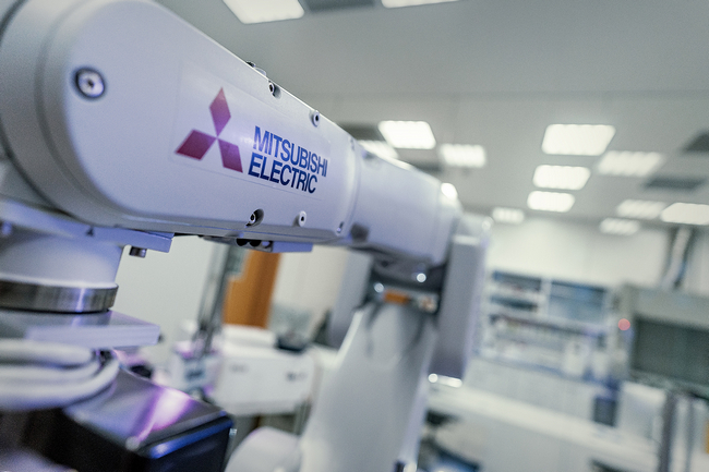Mitsubishi Electric's industrial robot offers a long arm reach as well as an integrated set of robot-controlled tools for micro-scale test series on 96- and 384-well microassay plates. [Source: Institute of Bioorganic Chemistry, Polish Academy of Sciences (IBCH PAS)]