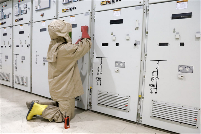 Engineer wears suit to protect from potential arc flash